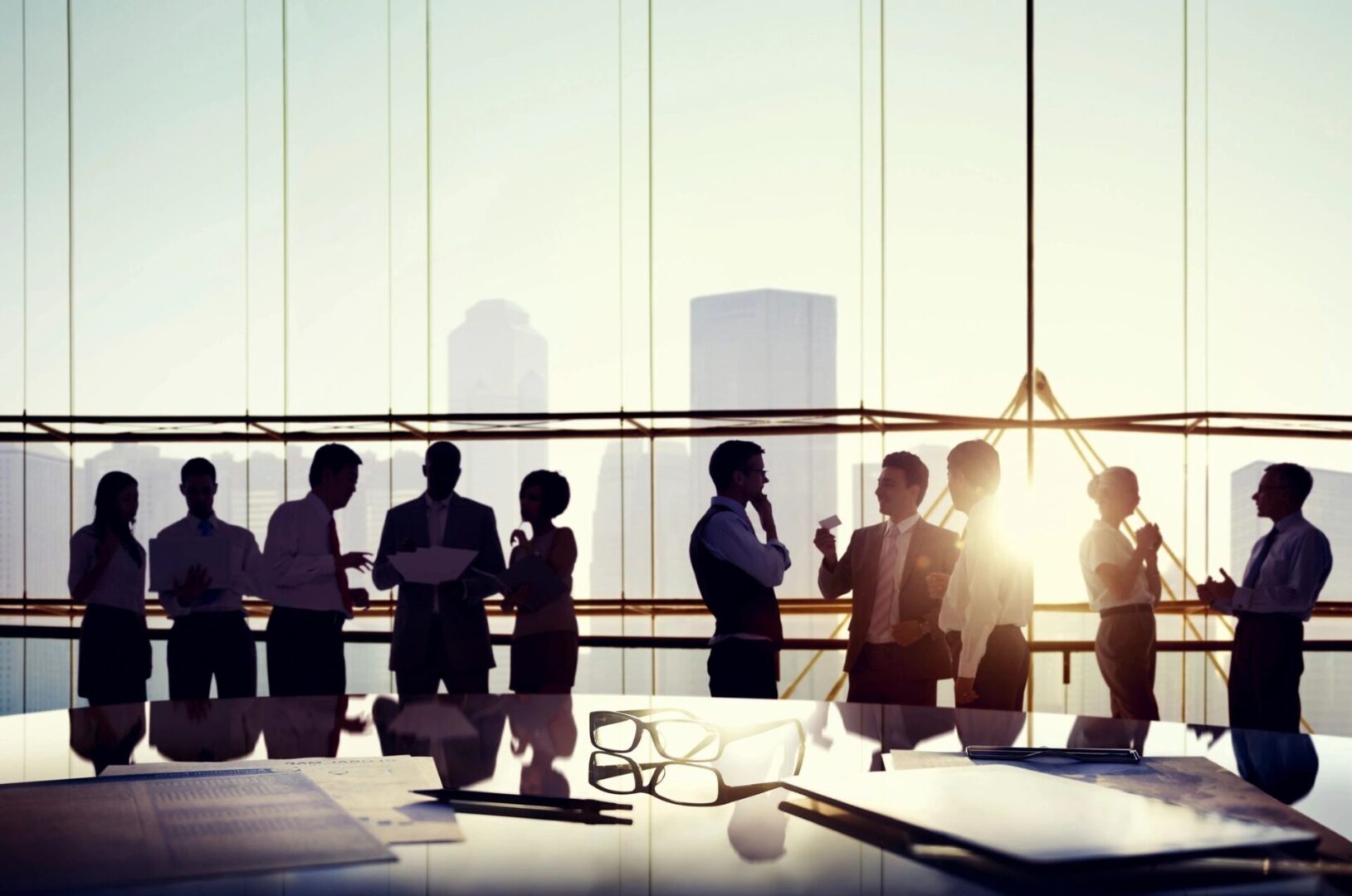 A group of people standing around a table.