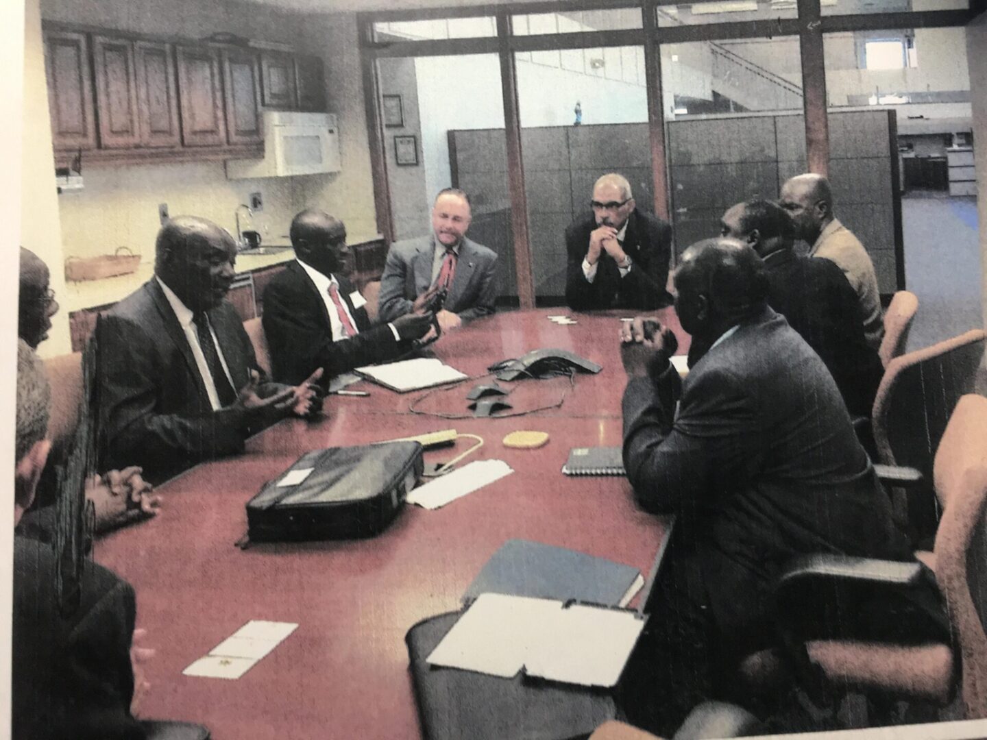 A group of people sitting around a table.