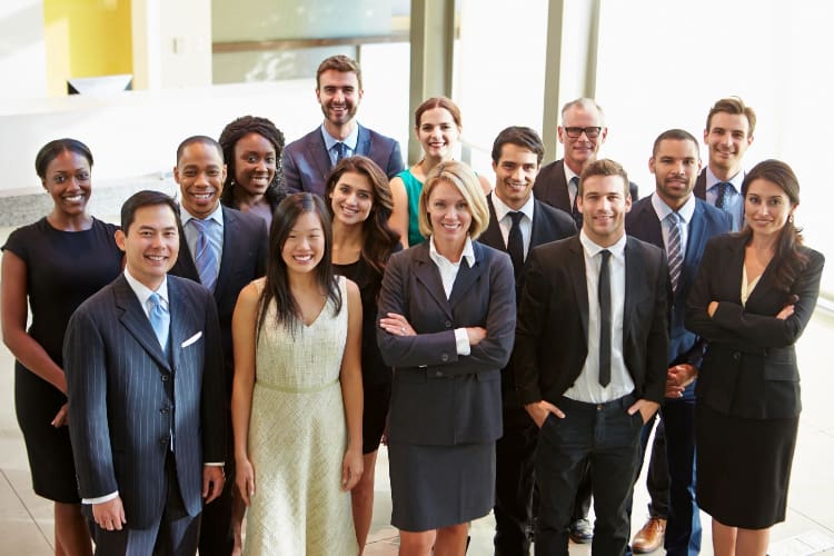 1 A group of people in suits and ties standing together.